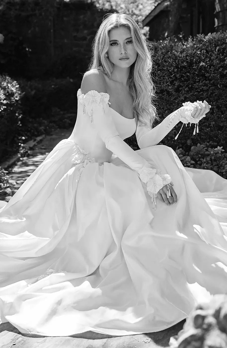 Model wearing a white gown by Idan Cohen - black and white image