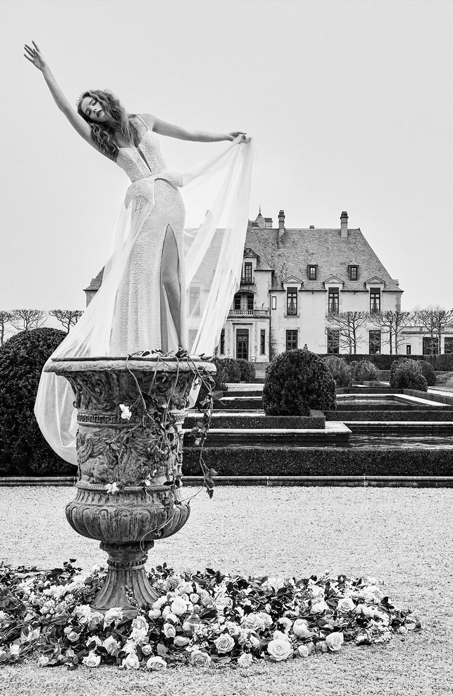 Model wearing a white gown by Idan Cohen - black and white image