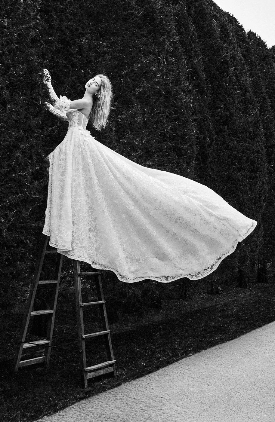 Model wearing a white gown by Idan Cohen - black and white image